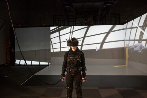 Man wearing head mounted display in a large-scale VR environment