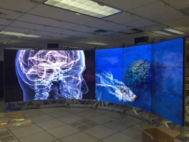 Immersive Video wall solution designed for IBM with capability to be curved or flat (Currently in curved position)