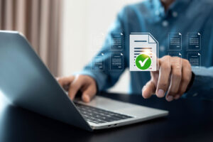 Ticket Management icon and man working on computer