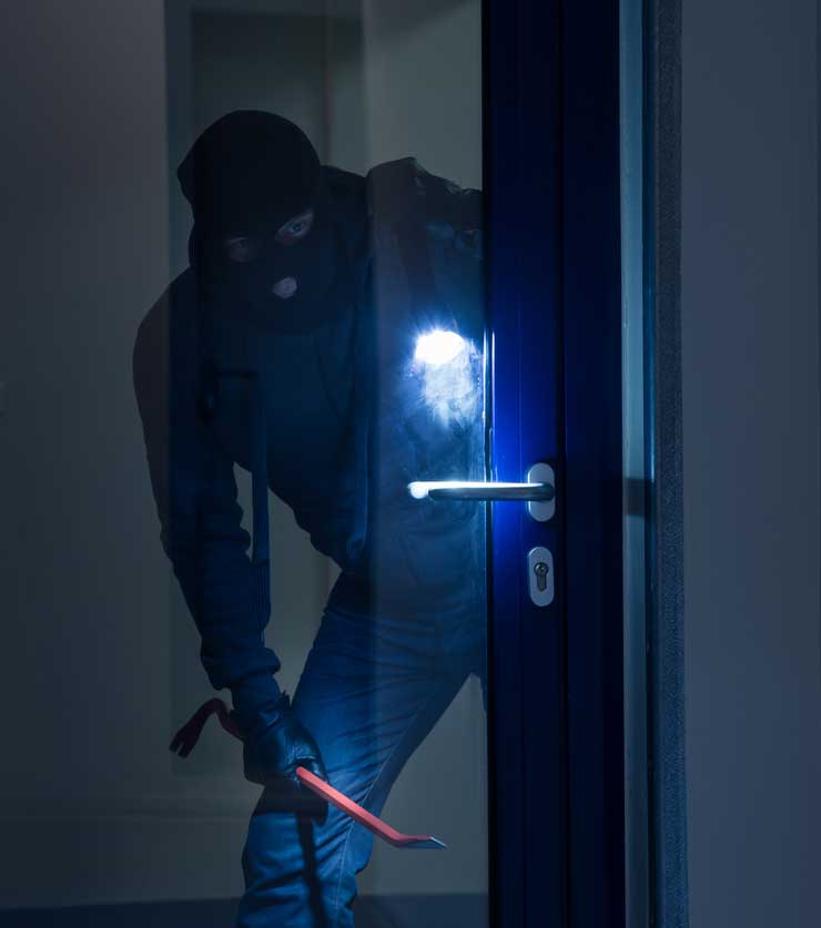 Intruder attempting to break into a secure facility